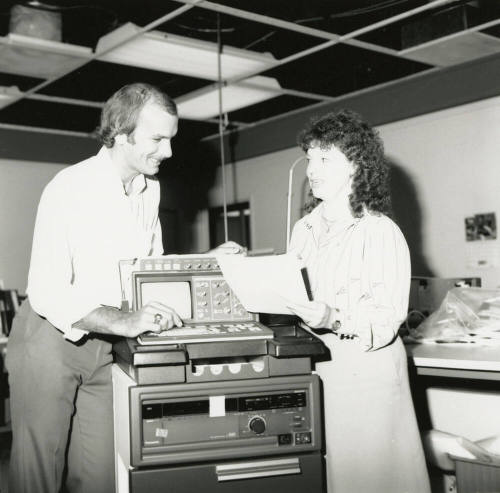 Unidentified Couple Discussing Electronic Device (EKG?)  - (1of 2)
