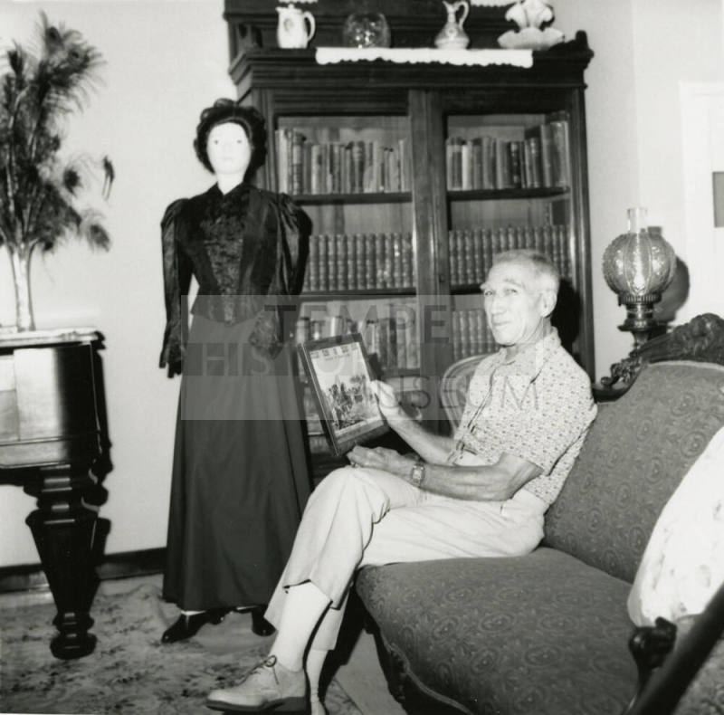 Unidentified Man In Antique Filled Room