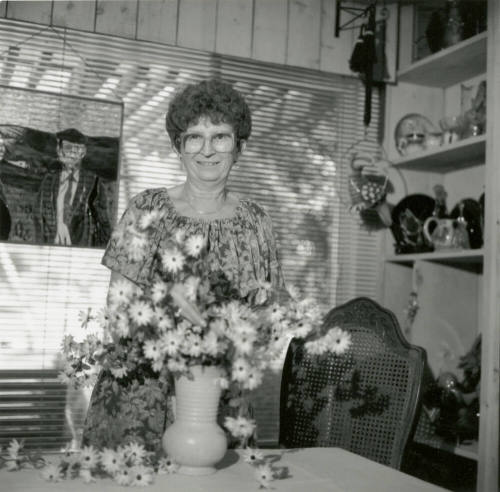 Woman Smiling with Flowers - September 1984