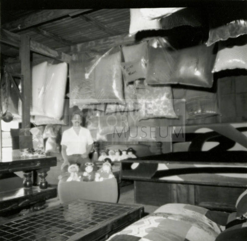 Man with stuffed animals and bagged material