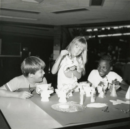 Unidentified children making paper angels