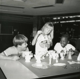 Unidentified children making paper angels