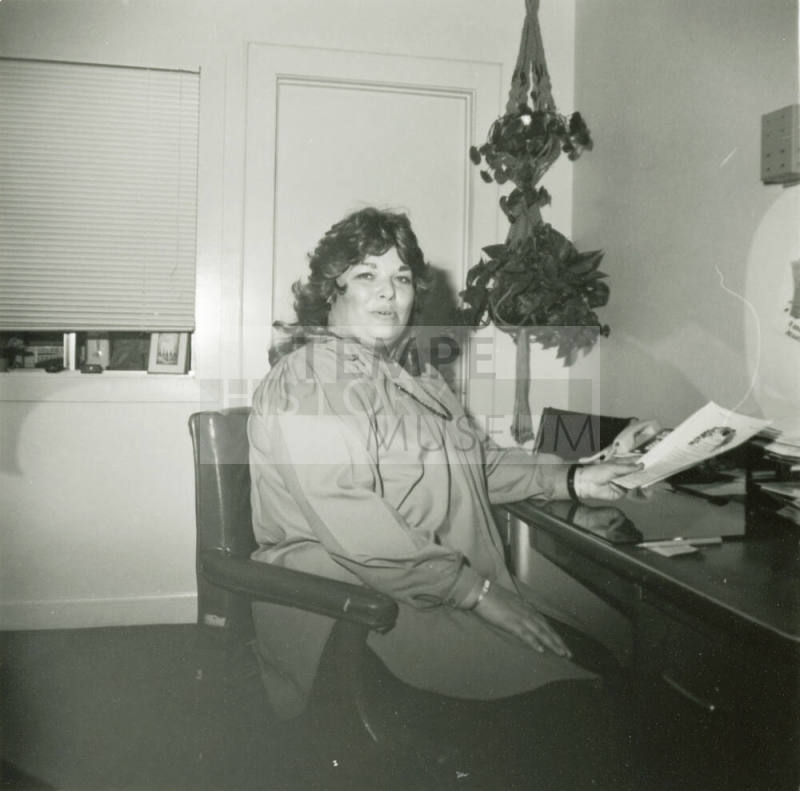 Unidentified woman sitting at an office desk