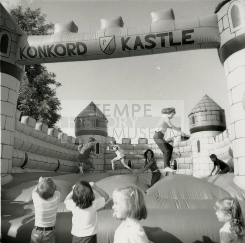 Unidentified children on inflated mock castle