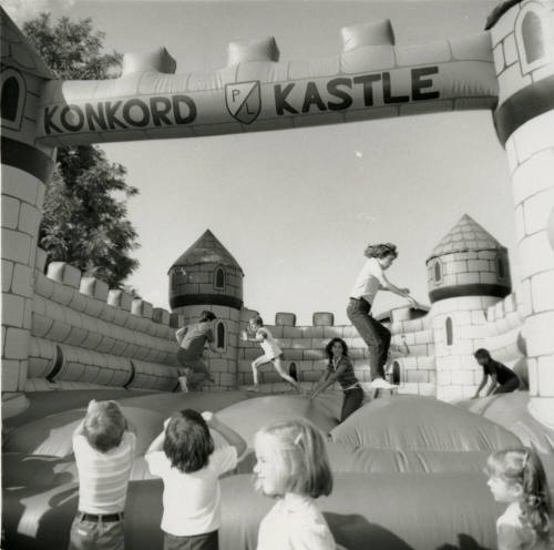 Unidentified children on inflated mock castle