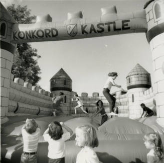 Unidentified children on inflated mock castle