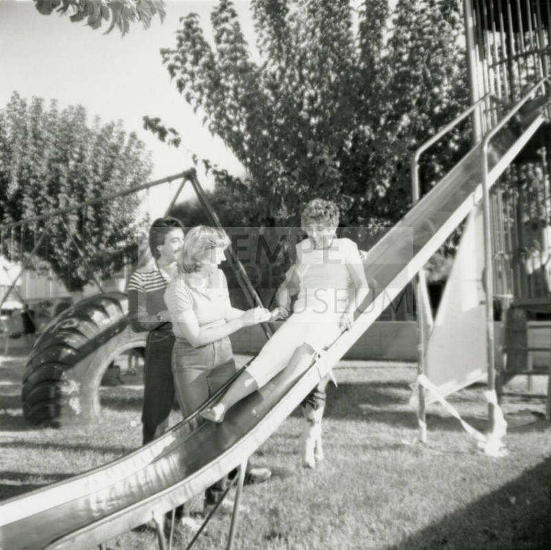 Unidentified Trio of Adults at Playground and/or Park
