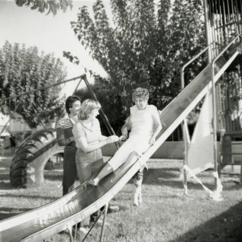 Unidentified Trio of Adults at Playground and/or Park