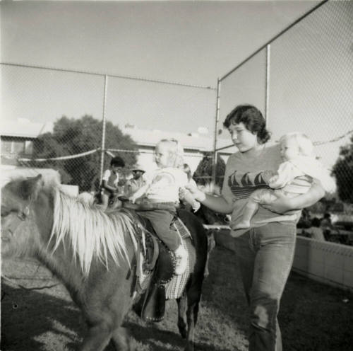 Unidentified Woman & 2 Children at Pony Ride