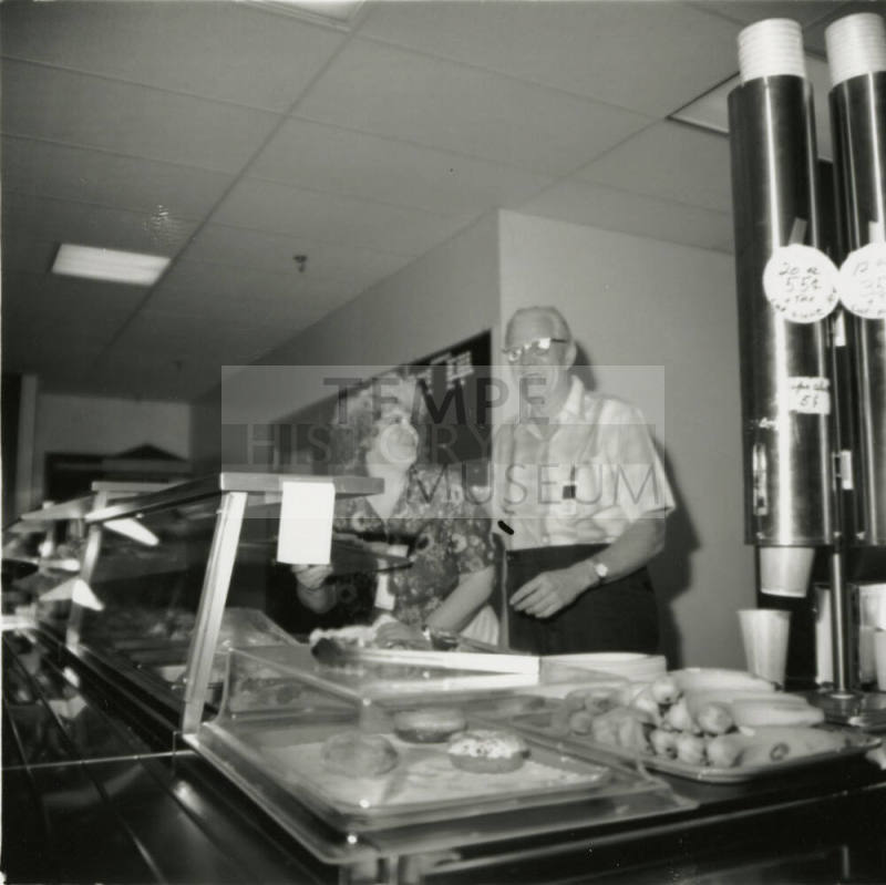 Unidentified Couple Behind A Cafeteria Line