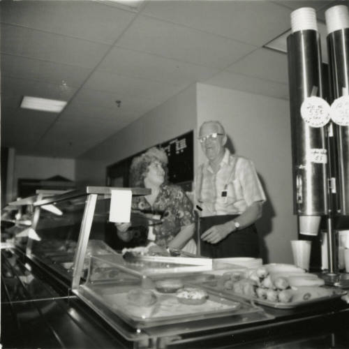 Unidentified Couple Behind A Cafeteria Line