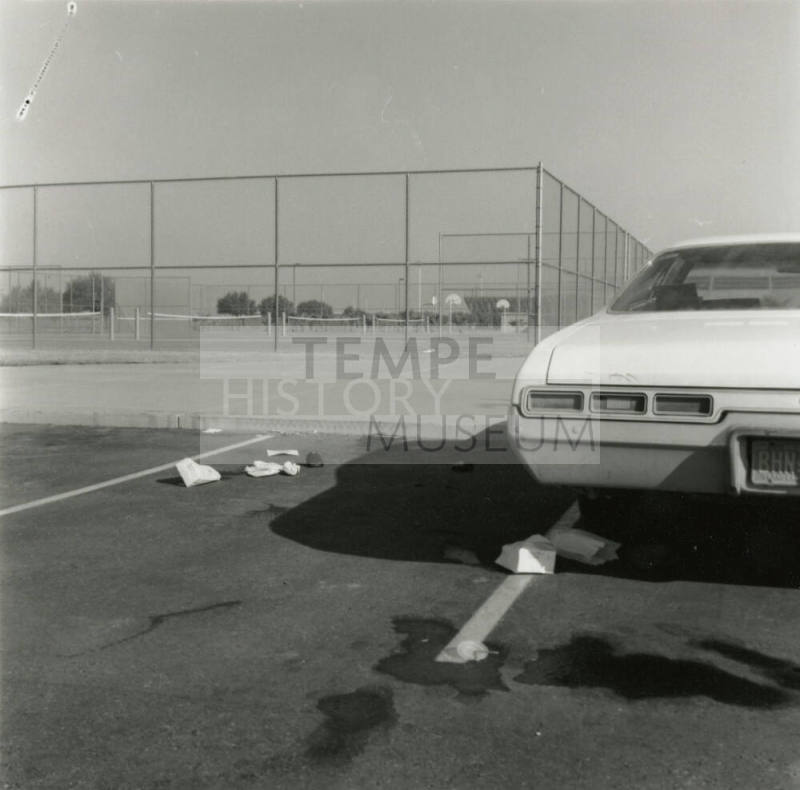 Corona's proud image buried in pile of litter. - Tempe Daily News, December 8 1984