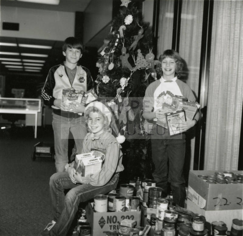 Cans for needy. - Tempe Daily News, December 19 1984