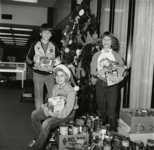 Cans for needy. - Tempe Daily News, December 19 1984