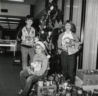 Cans for needy. - Tempe Daily News, December 19 1984