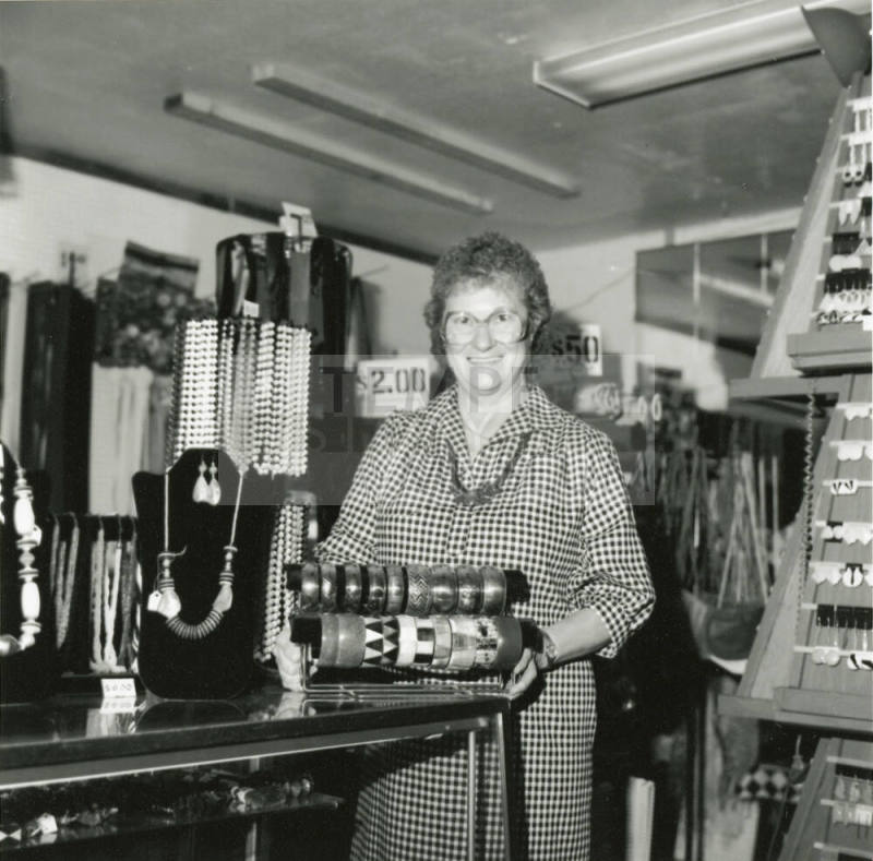 Woman at jewelry counter, January 21-27, 1985