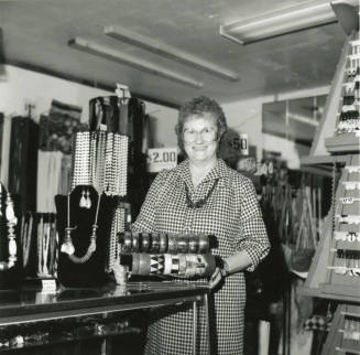 Woman at jewelry counter, January 21-27, 1985