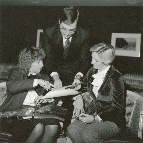 Unidentified picture of two women and one man