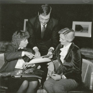 Unidentified picture of two women and one man
