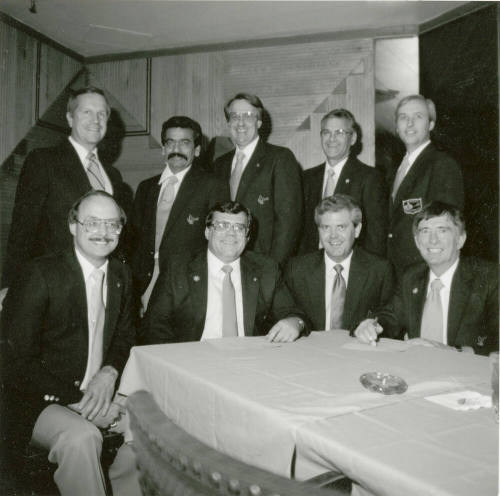 Nine unidentified men with Tempe Diablos insignia