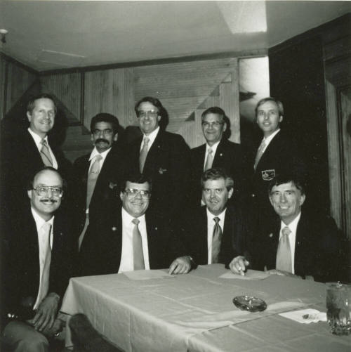 Nine unidentified men with Tempe Diablos insignia