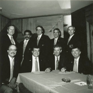 Nine unidentified men with Tempe Diablos insignia