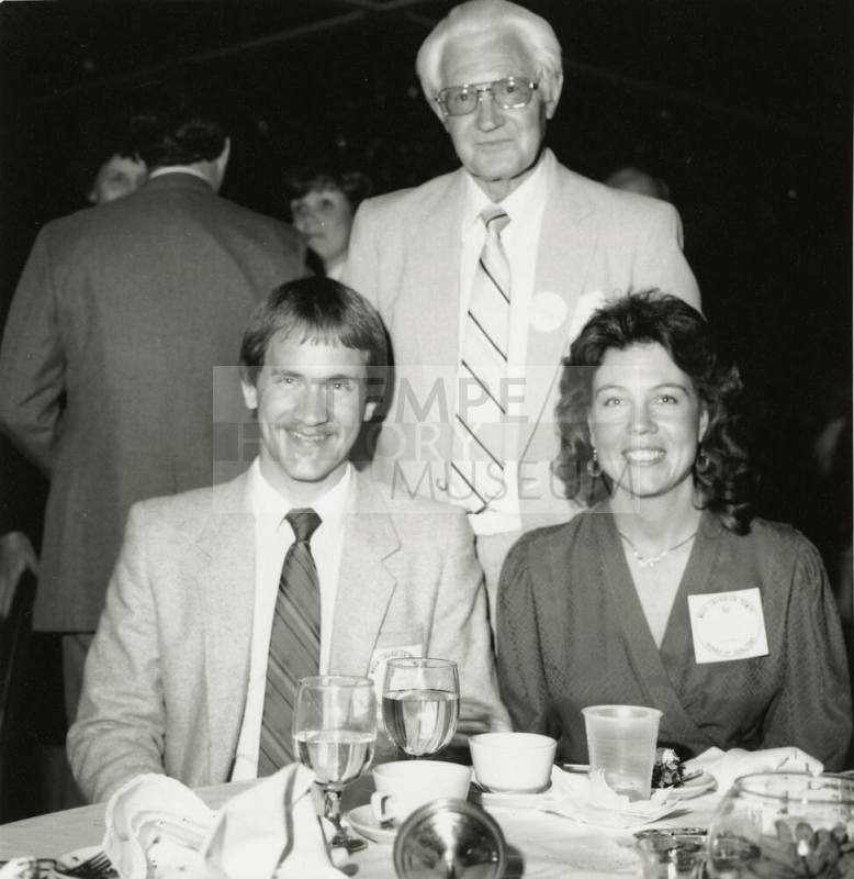 Three Unidentified Individuals at an Event