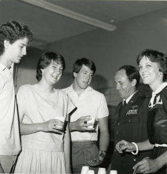 Unidentified Group Gathered Around a Punch Bowl