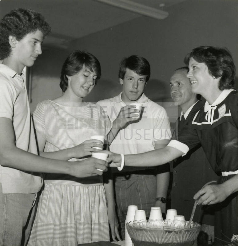 Unidentified Group Gathered Around A Punch Bowl