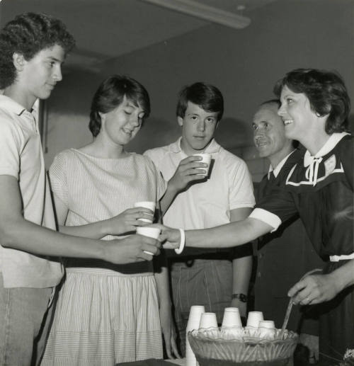 Unidentified Group Gathered Around A Punch Bowl