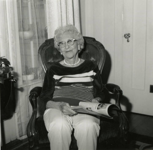 Unidentified Woman Reading Paper - (1 of 2)