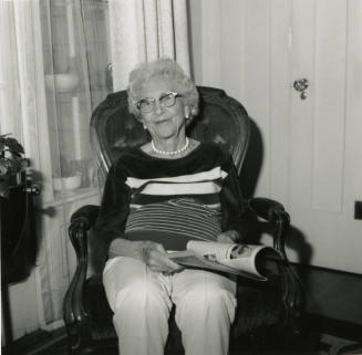 Unidentified Woman Reading Paper - (1 of 2)
