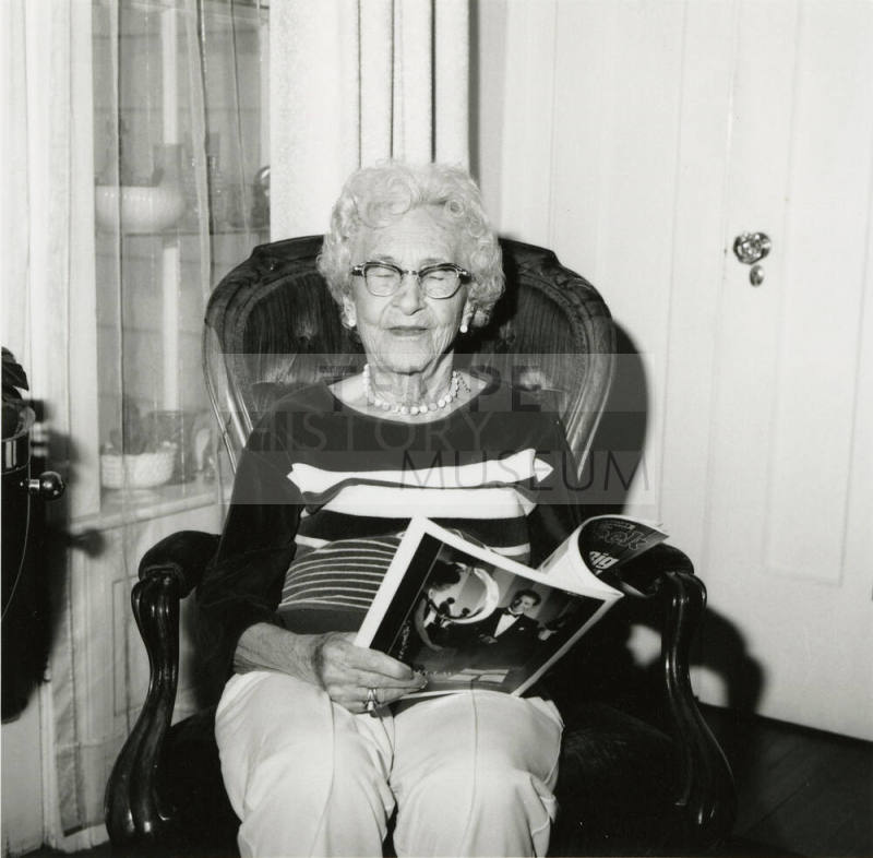 Unidentified Woman Reading Paper - (2 of 2)