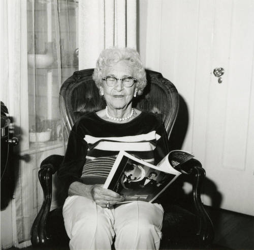 Unidentified Woman Reading Paper - (2 of 2)