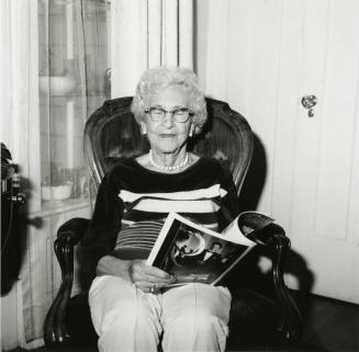 Unidentified Woman Reading Paper - (2 of 2)