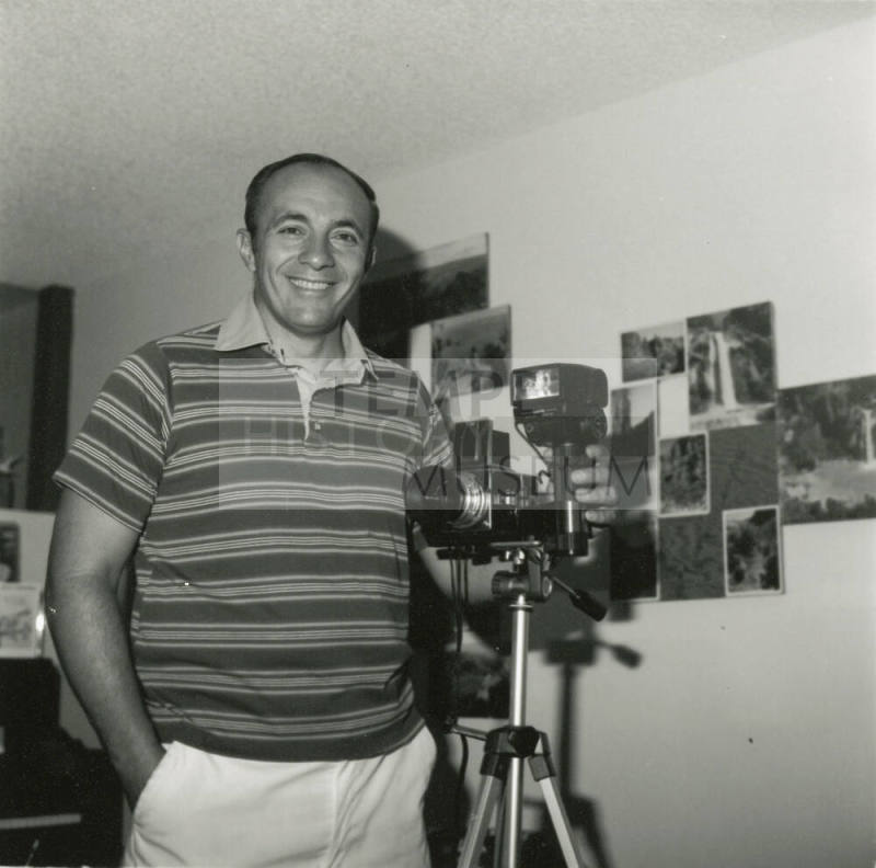 Man posing with camera.