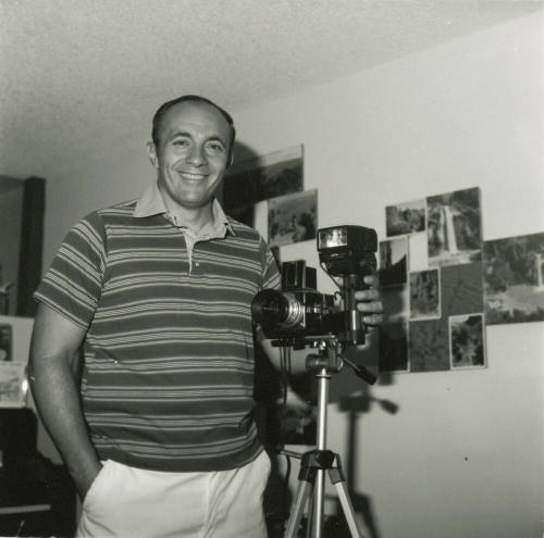 Man posing with camera.