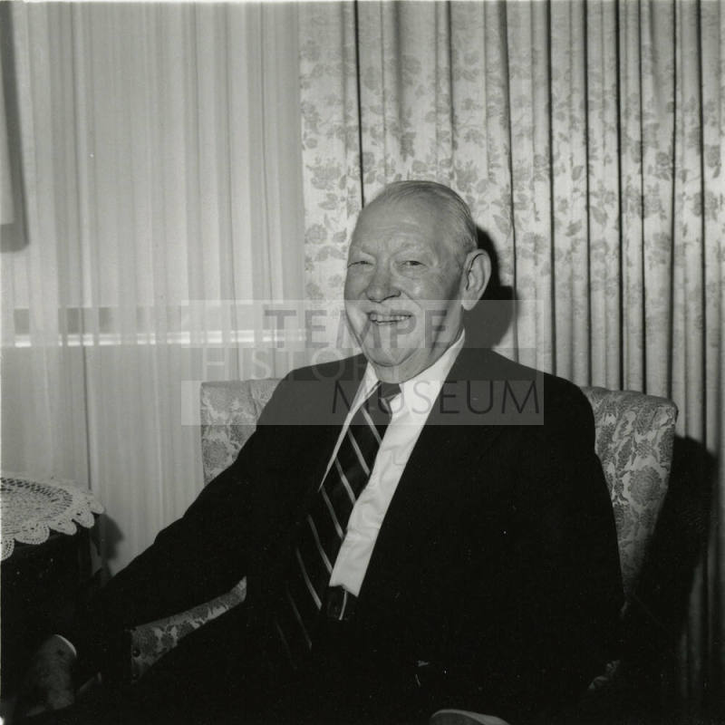 Unidentified Smiling Man Sits & Smiles in Living Room - (2 of 2)