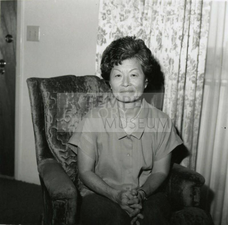 Unidentified Woman Holds Oriental Statuette - (2 of 2)