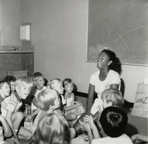 Love affair - Recreation leader shows affection to 42 children - Tempe Daily News - August 6, 1985
