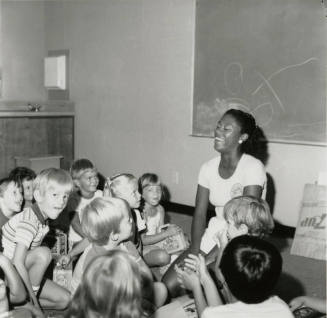 Love affair - Recreation leader shows affection to 42 children - Tempe Daily News - August 6, 1985