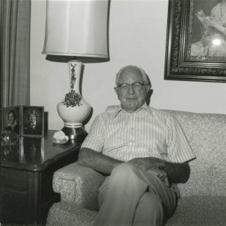 Unidentified Gray Haired Man on Sofa