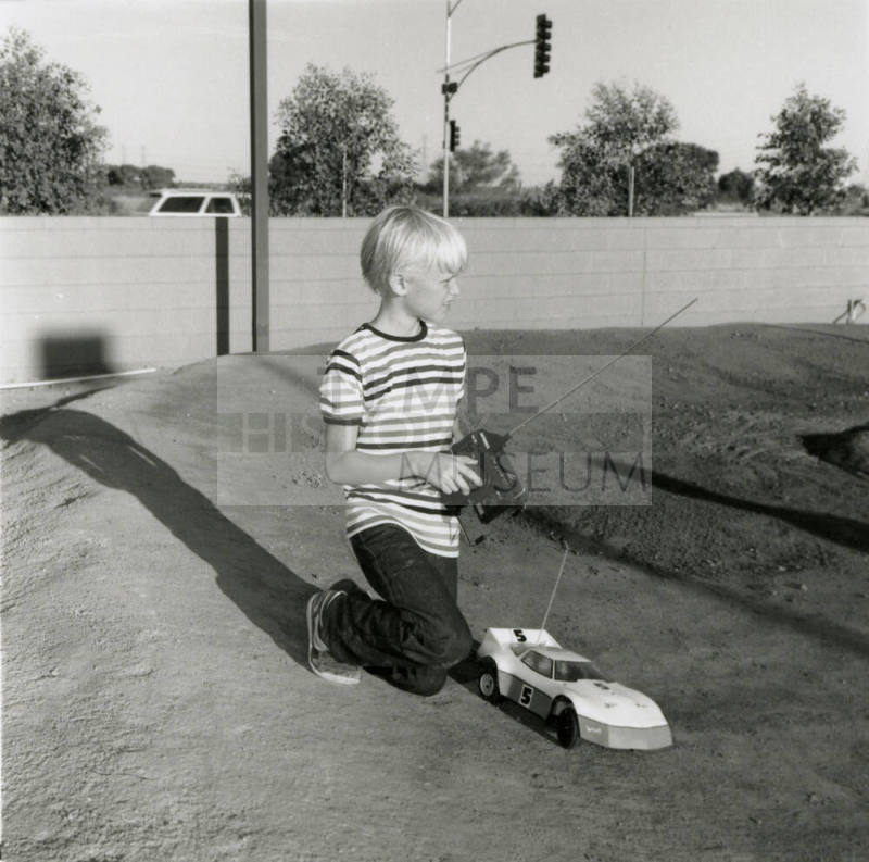 Unidentified Boy with Remote Control (RC) Car