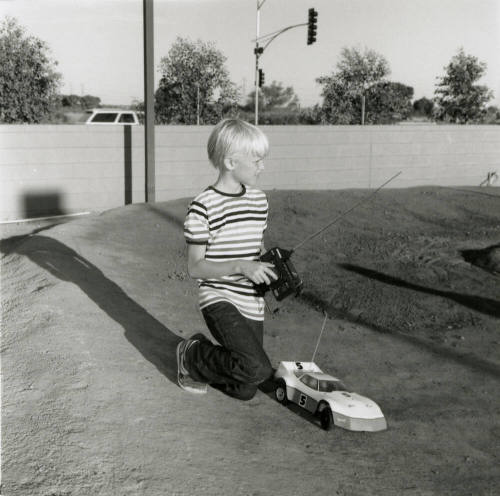 Unidentified Boy with Remote Control (RC) Car