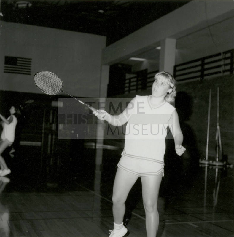 Unidentified Woman Practicing With Racket in Gym - (1 of 3)