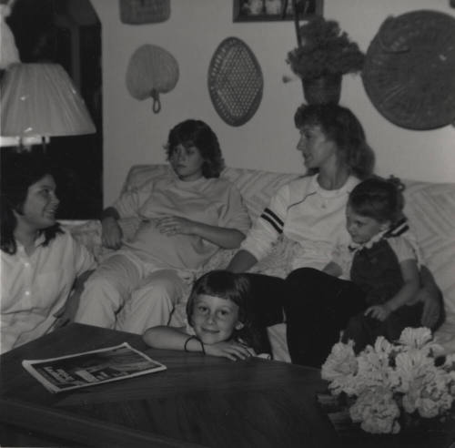 Family sits in their living room