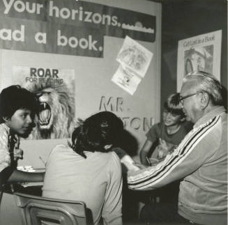 Getting an earful: Retired machinist hears 987 book reports. - Tempe Daily News, December 20 1985