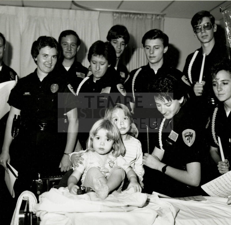 Tempe police Dept. Explorers at st.Luke's- Tempe Daily News, December 28 1985