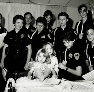 Tempe police Dept. Explorers at st.Luke's- Tempe Daily News, December 28 1985
