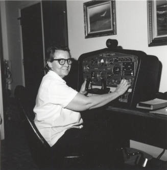 Woman in glasses in front of a machine